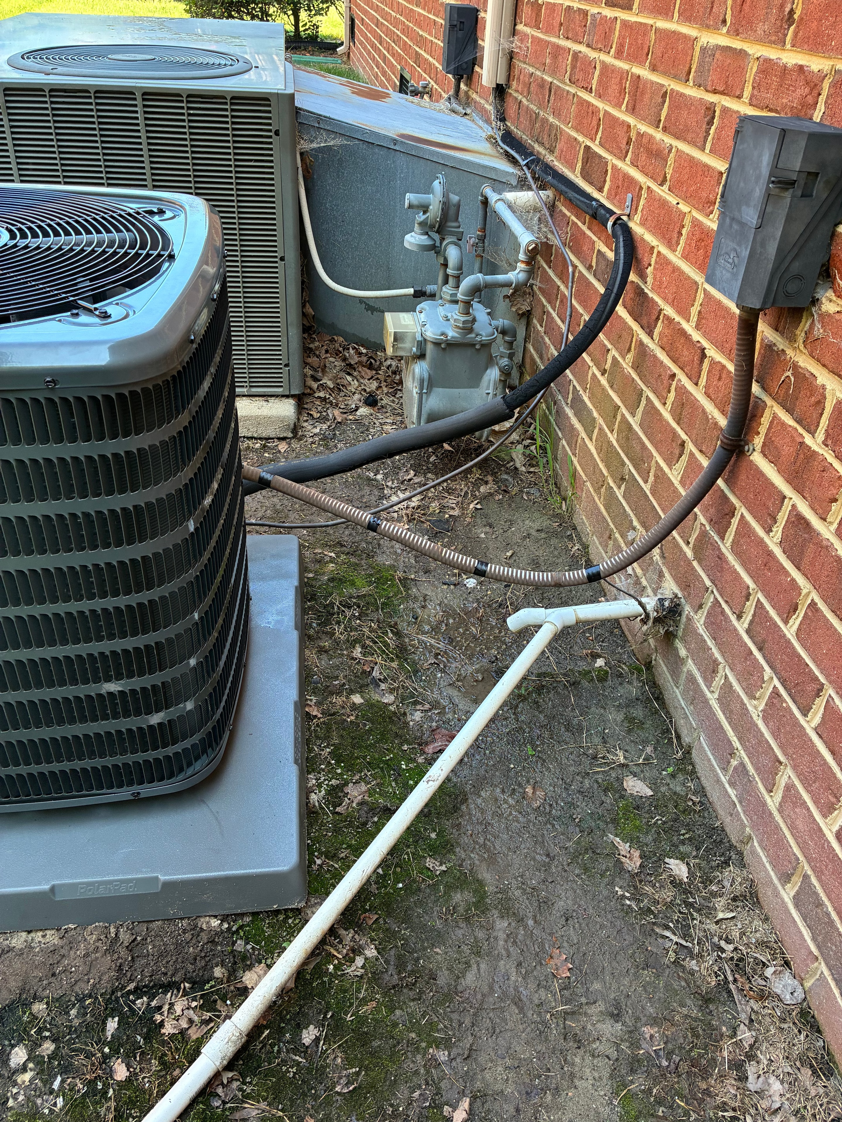Dual AC condenser units installed at residential property