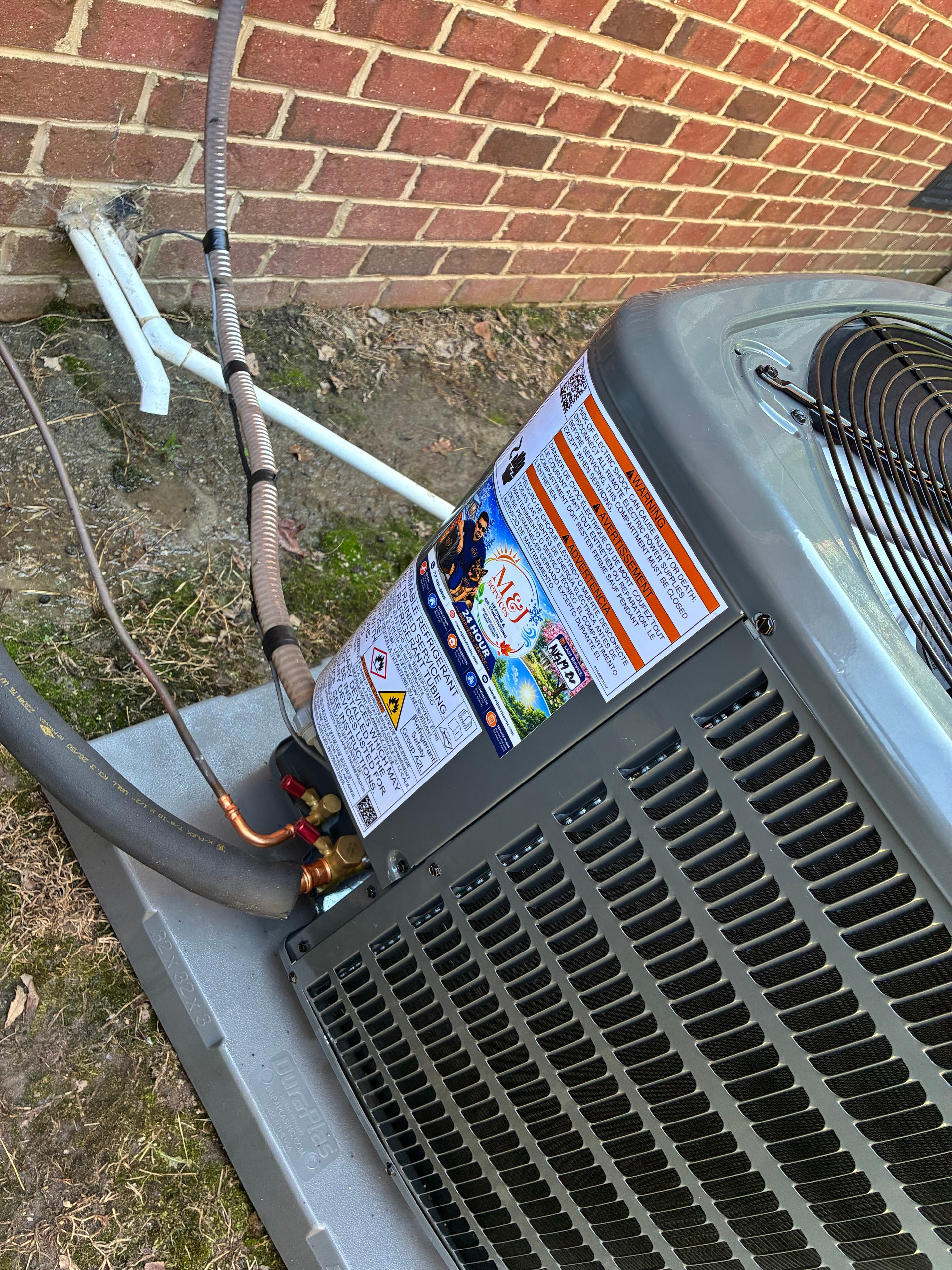 M&J Services branded AC unit installation