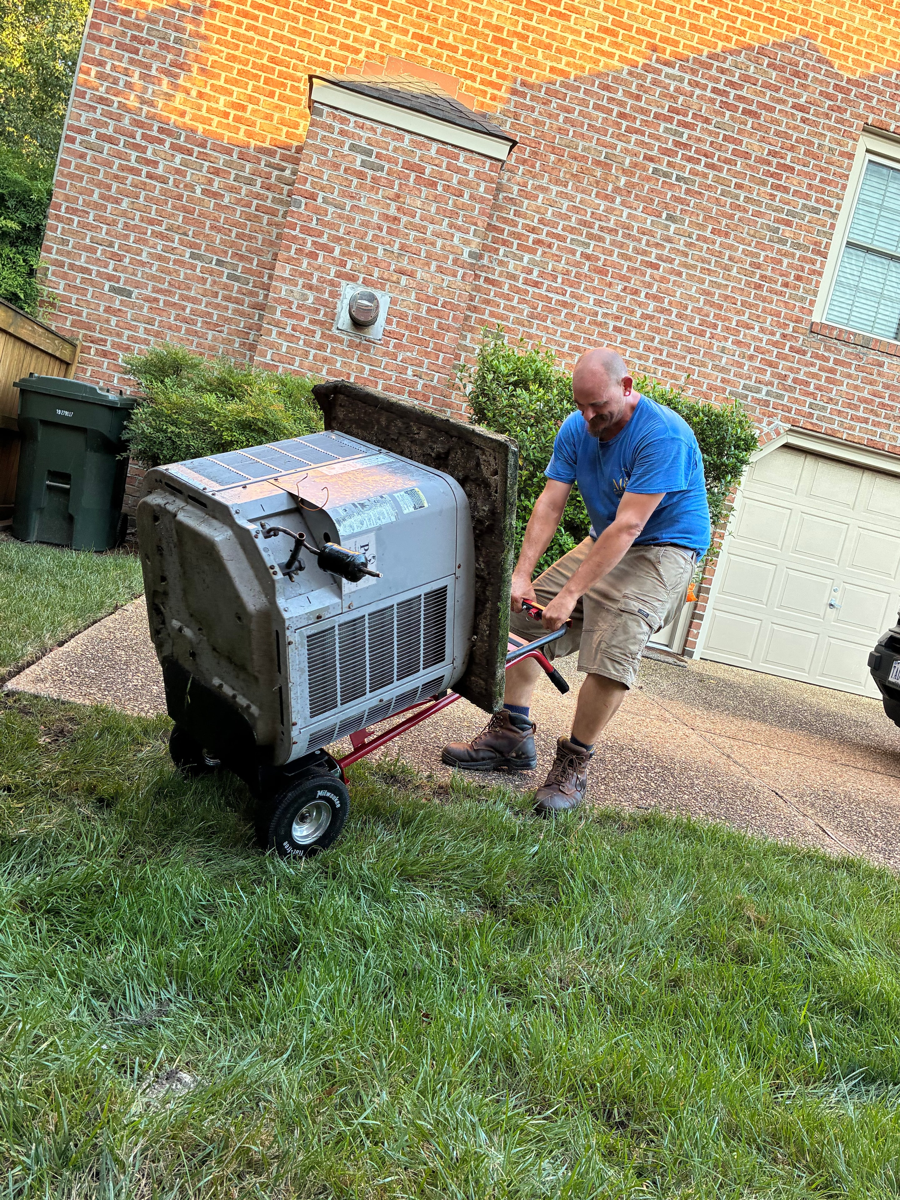 M&J Services technician removing old HVAC unit